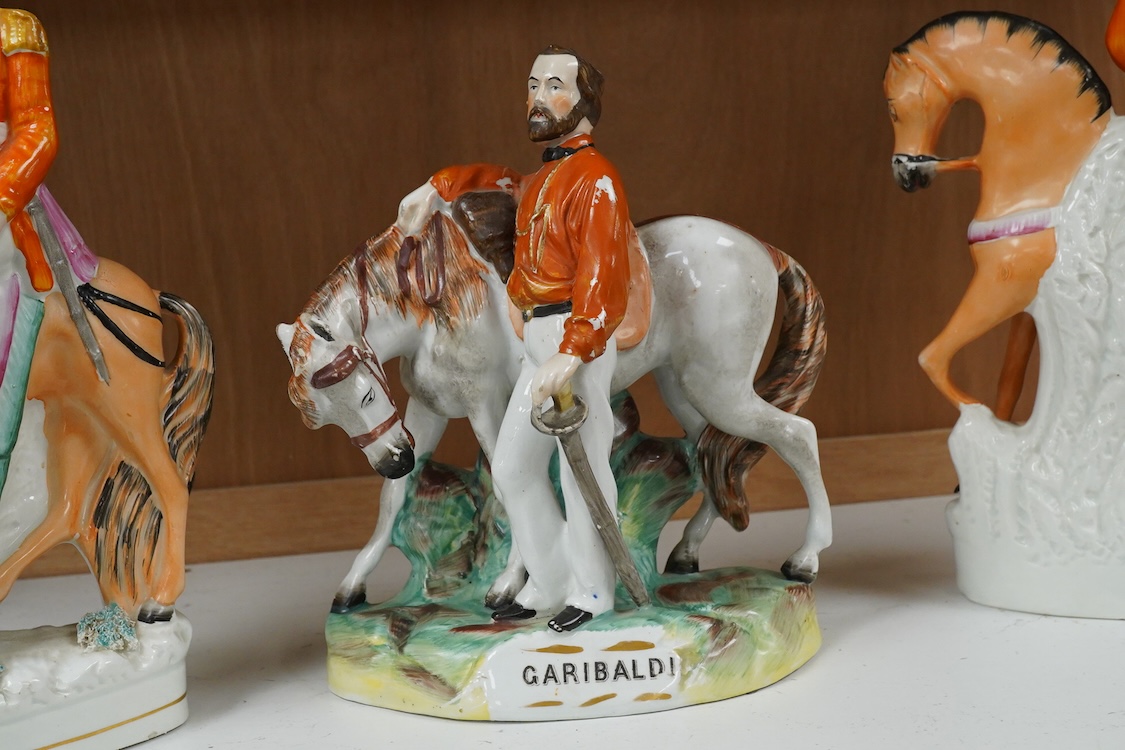 Three Staffordshire flatback figures of Garibaldi, mid 19th century, largest 29cm high